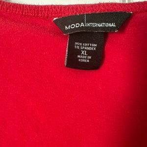 Moda International Red heavy Tshirt type material. Very comfortable. Shelf bra